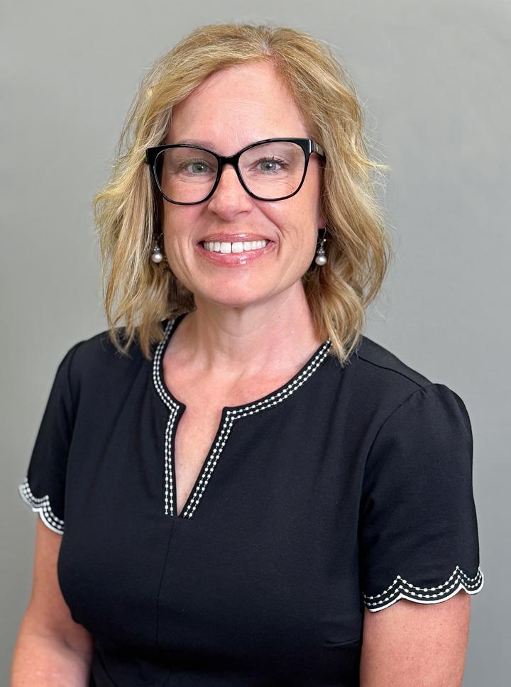 Holly Ruskin headshot in a black dress