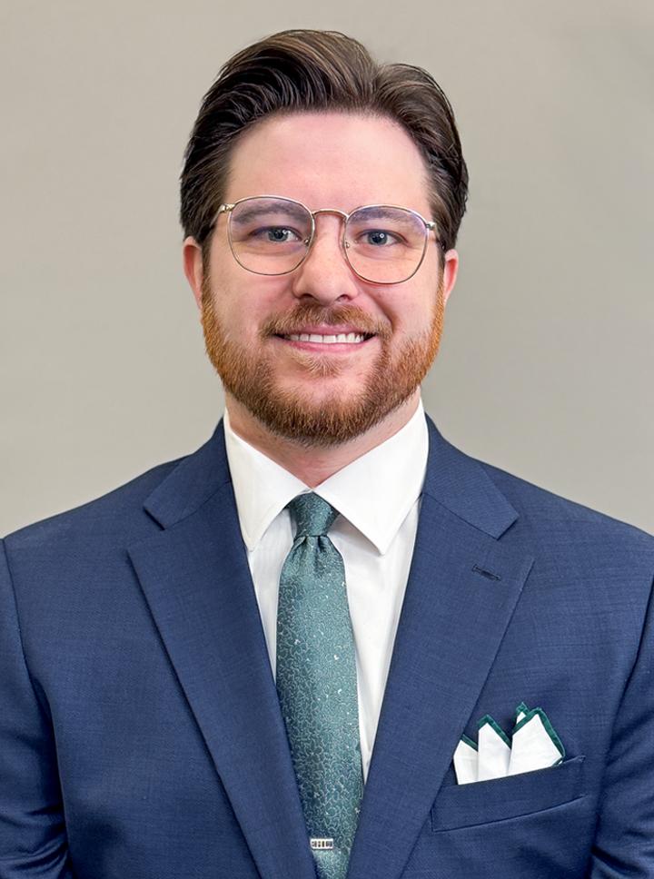 Hunter-Lindsey headshot in a blue suit